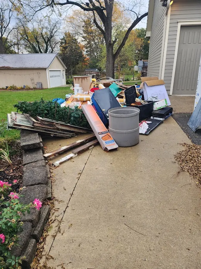 Dumpster being loaded with debris for Commercial Dumpster Rental in Knightdale